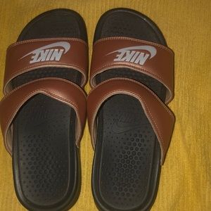 Nike, rose gold slides. Fits a sized 9 foot.